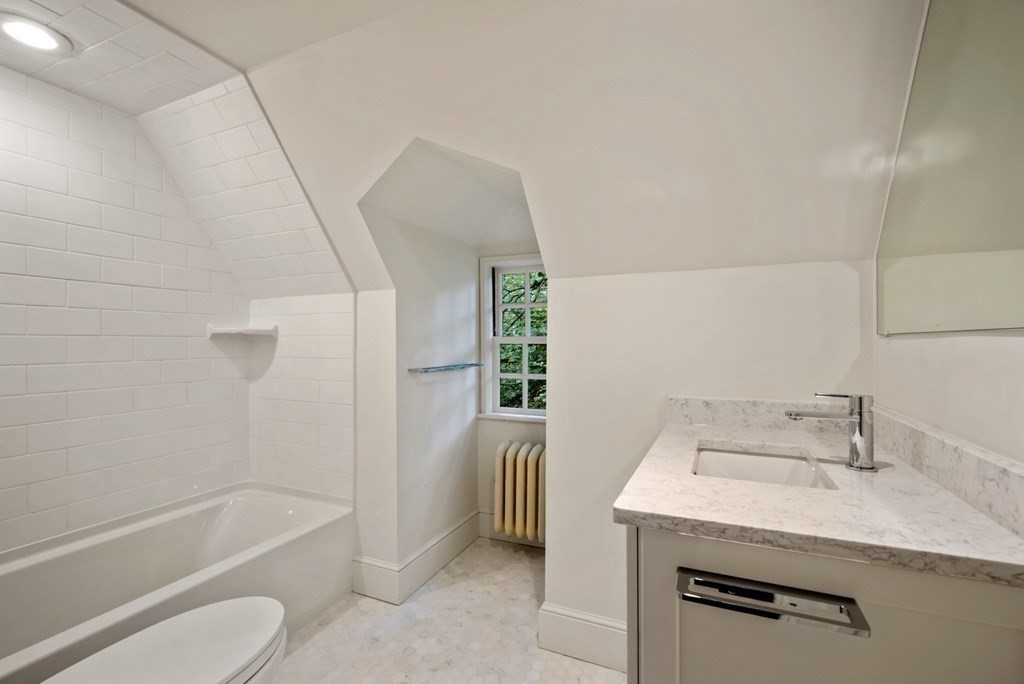 110 Hundreds Road Wellesley, MA 02481 - Photo 38 of 42 a bathroom with a granite countertop sink toilet and shower