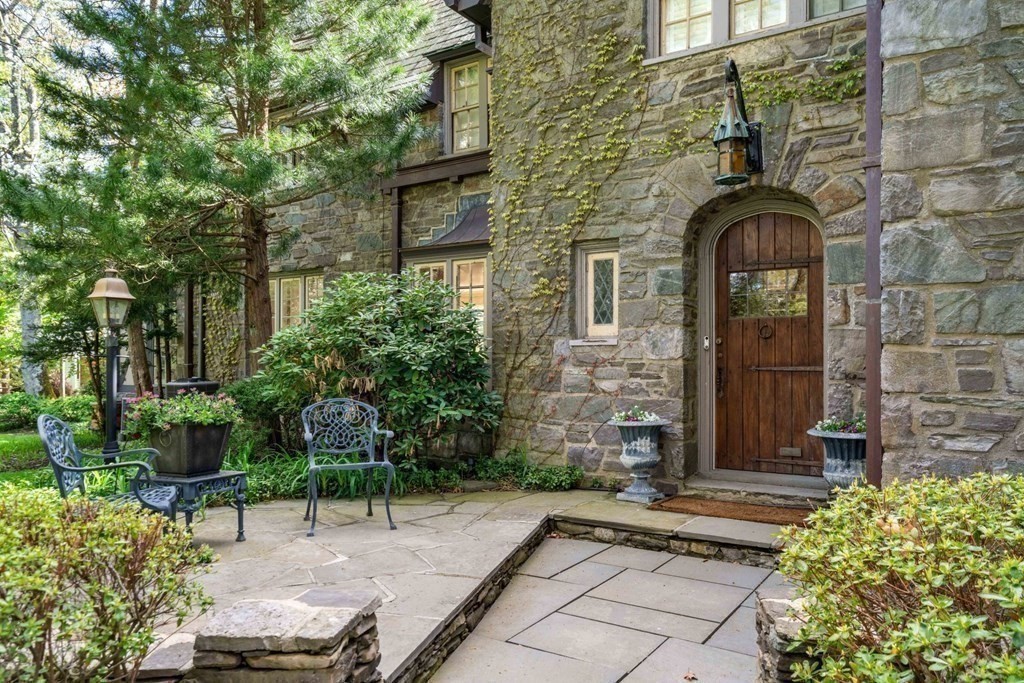 110 Hundreds Road Wellesley, MA 02481 - Photo 6 of 42 a front view of a house with garden