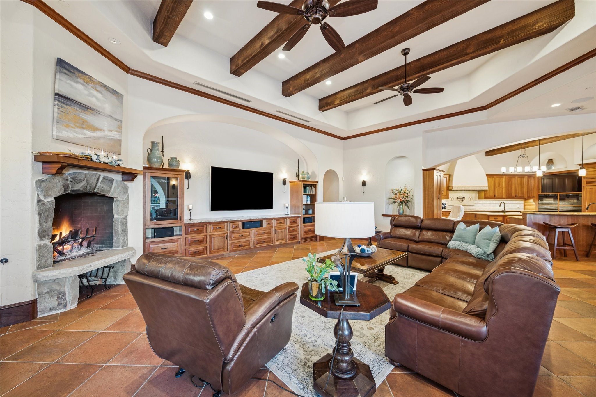 21538 Mueschke Road Tomball, TX 77377 - Photo 12 of 50 Thoughtfully designed family room. Every material and natural element in this beautiful home has been carefully chosen to reflect the warm, earthy style throughout the interior. This view showcases another angle of the spacious family room, the open-concept flow to the kitchen, and the hallways leading to the bedrooms. The design and details of this home are truly special, you’ll be captivated.