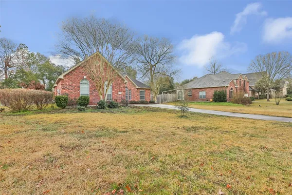 a house view with swimming pool in front of it
