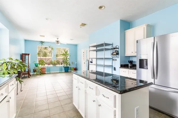 a kitchen with stainless steel appliances a sink a stove and a refrigerator