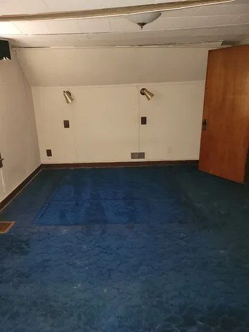 a view of a utility room with wooden floor