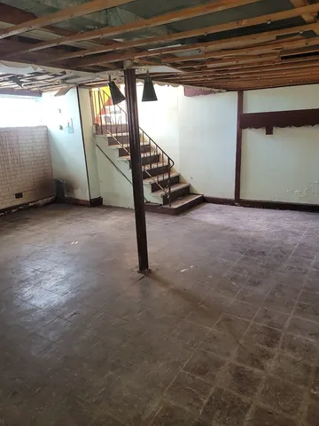 a view of an empty room with stairs