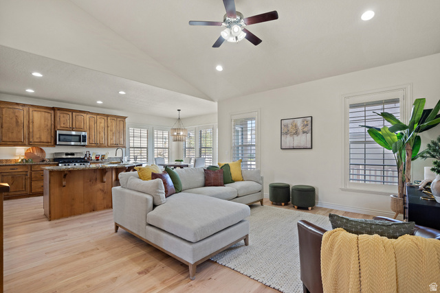 927 Iris Lane Mapleton, UT 84664 - Photo 5 of 31 Open-concept living area with wood-finish flooring, vaulted ceilings, and recessed lighting