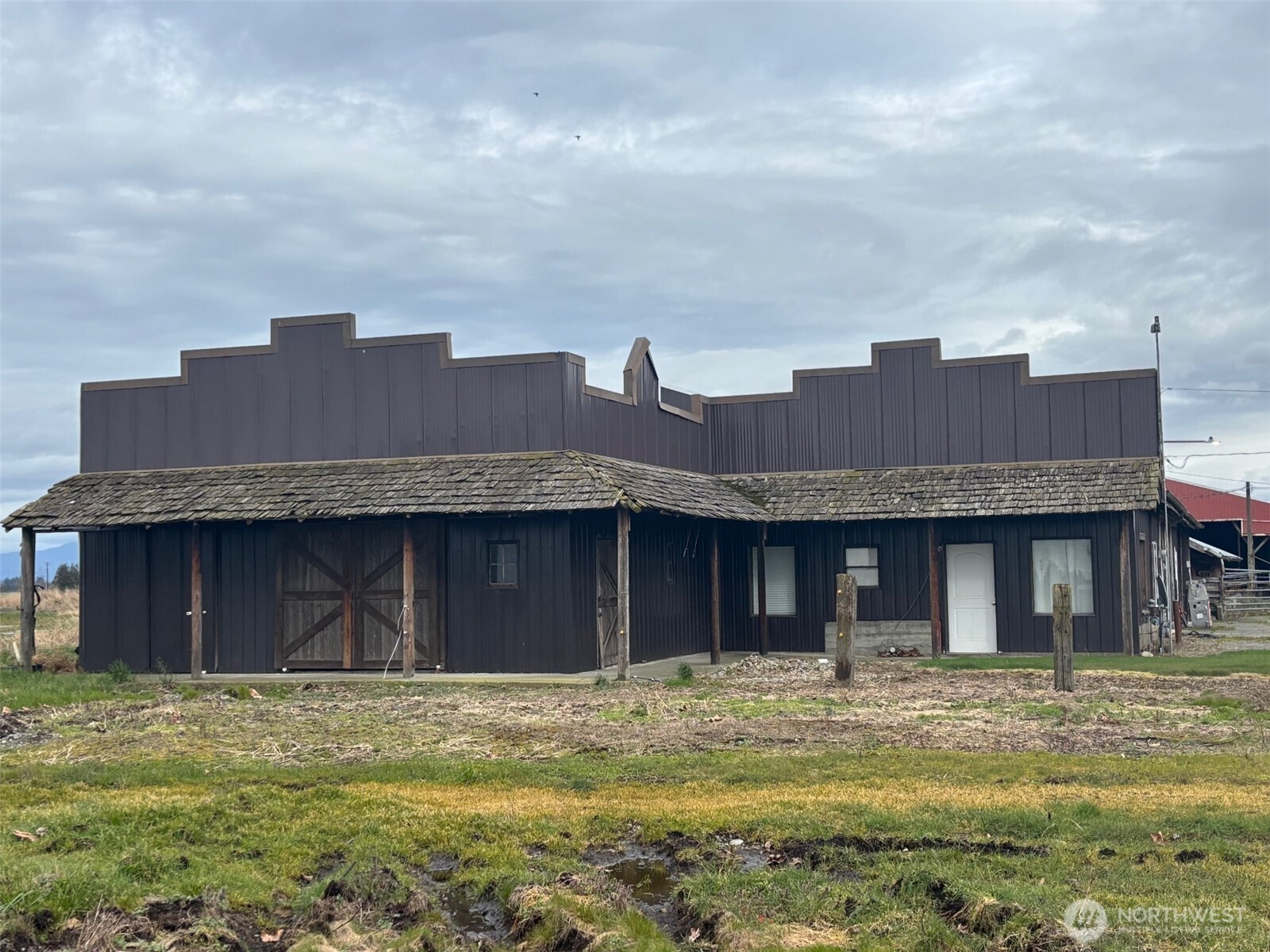 790 East Badger Road Lynden, WA 98264 - Photo 19 of 26 a front view of a house with a garden