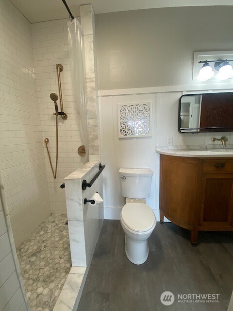 790 East Badger Road Lynden, WA 98264 - Photo 9 of 26 a bathroom with a toilet sink and shower