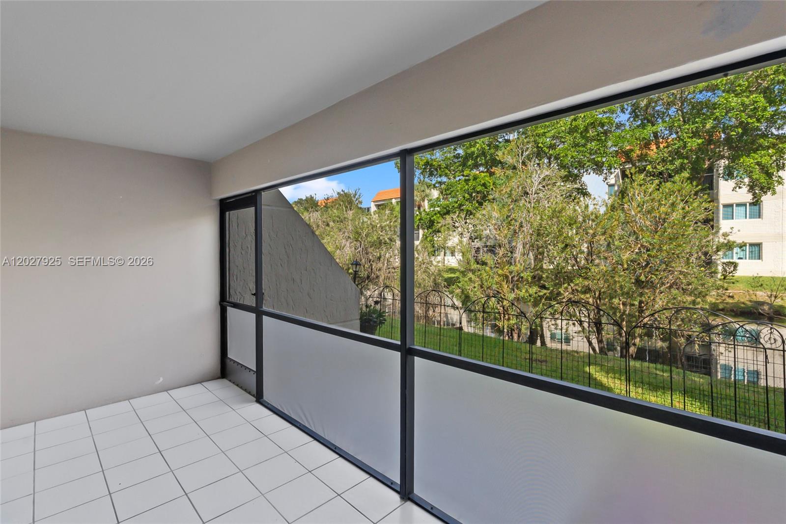 301 Racquet Club Road, Unit 103 Weston, FL 33326 - Photo 17 of 20 a view of a room with a large window
