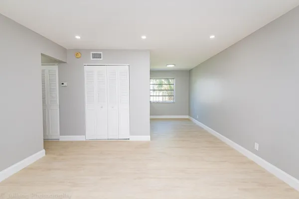 a view of an empty room with a window