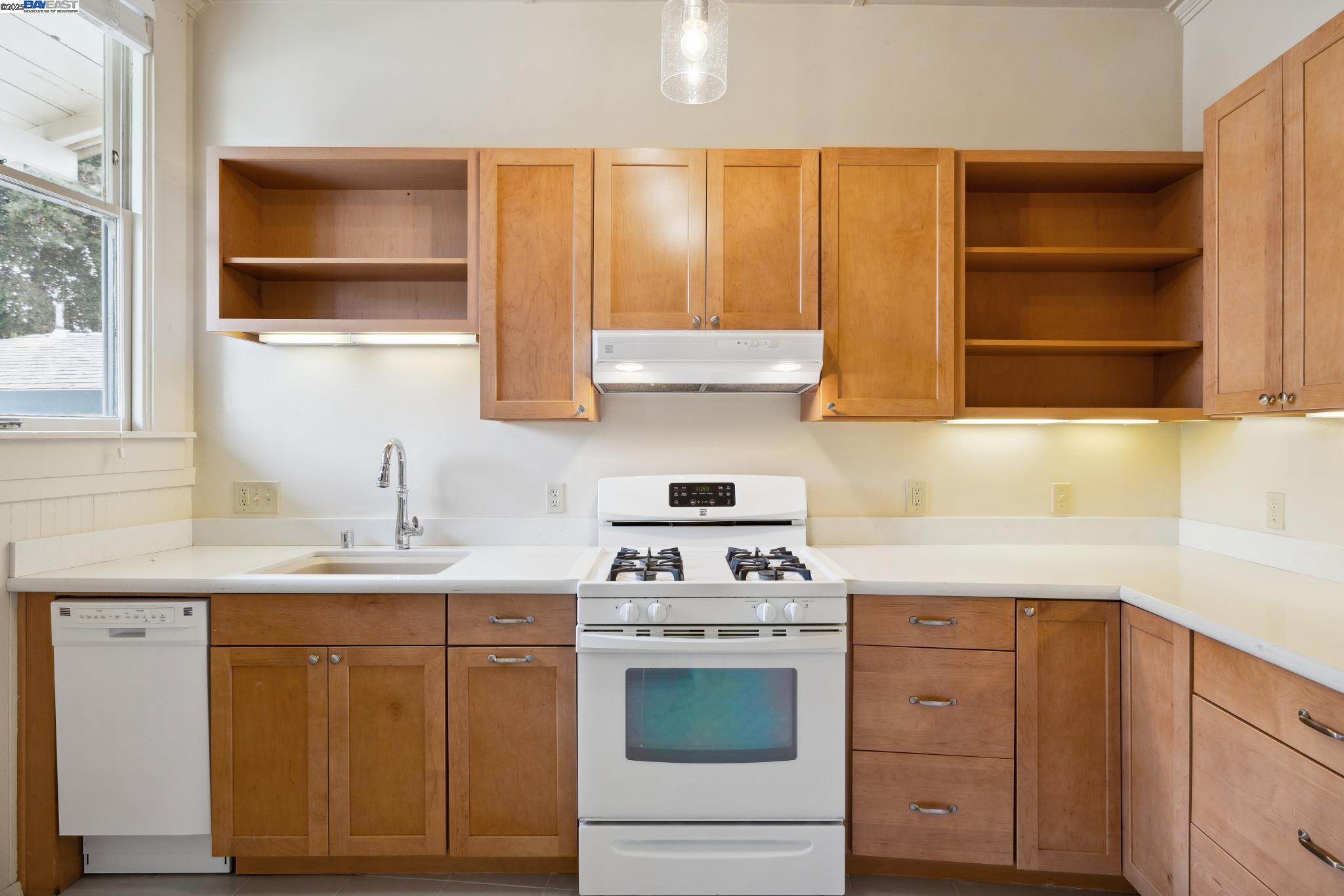 1820 3rd Street Alameda, CA 94501 - Photo 36 of 60 a kitchen with a sink stove and cabinets