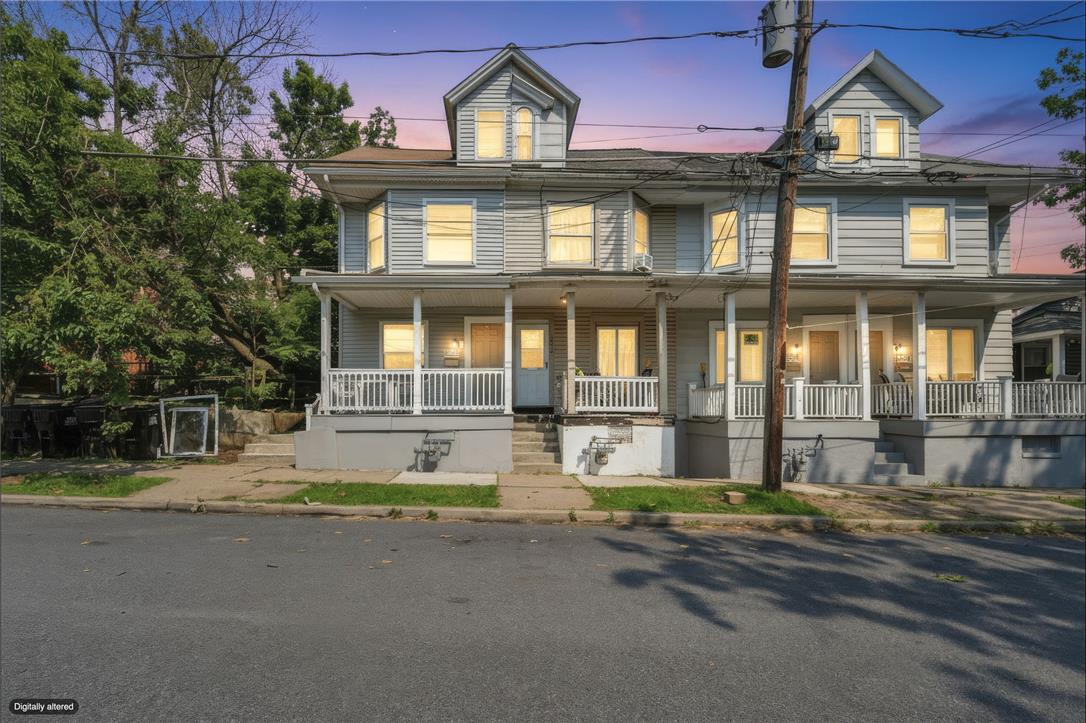 1030 Monocacy Street Bethlehem, PA 18018 - Photo 2 of 34 Multi-family residential architecture features expansive covered front porches and classic symmetrical siding.