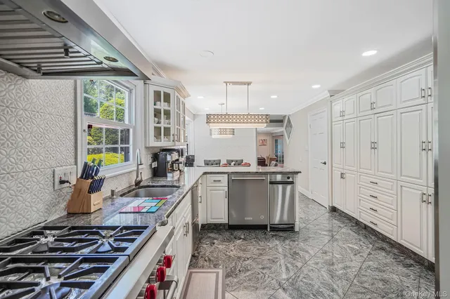 a kitchen with a stove and a sink