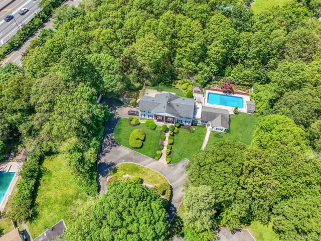 an aerial view of a house with a garden