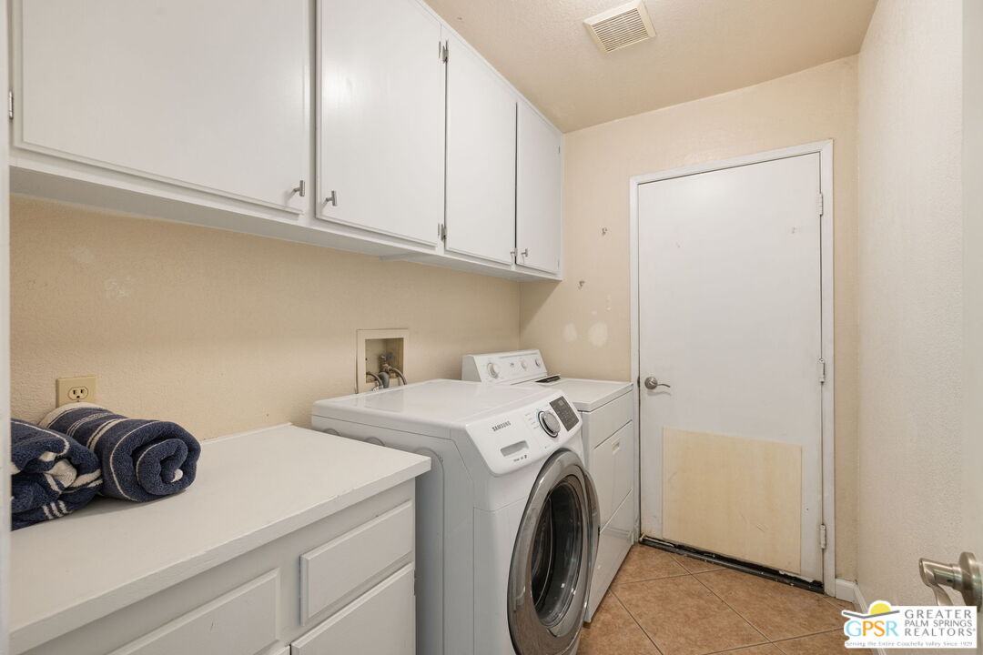 45688 Sutter Creek Road Indio, CA 92201 - Photo 36 of 51 a utility room with dryer and washer