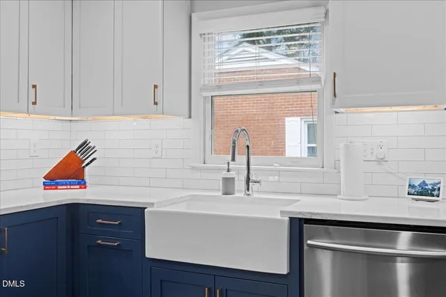 a kitchen with a sink stove and microwave