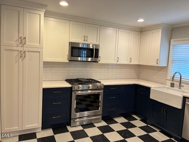 1212 Brookside Drive Raleigh, NC 27604 - Photo 12 of 42 a kitchen with granite countertop white cabinets and black appliances