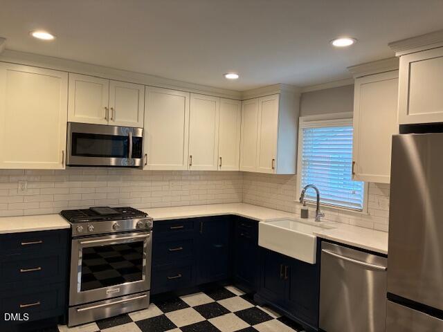 1212 Brookside Drive Raleigh, NC 27604 - Photo 15 of 42 a kitchen with a sink stove and microwave