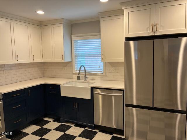 1212 Brookside Drive Raleigh, NC 27604 - Photo 16 of 42 a kitchen with a sink a refrigerator and cabinets