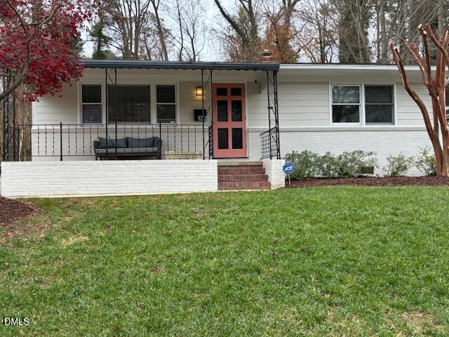 1212 Brookside Drive Raleigh, NC 27604 - Photo 2 of 42 front view of a house with a yard