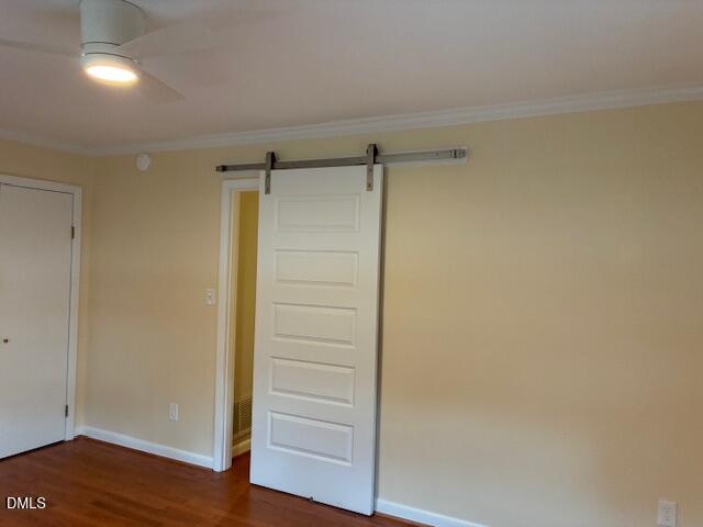1212 Brookside Drive Raleigh, NC 27604 - Photo 25 of 42 a view of walk in closet with wooden floor