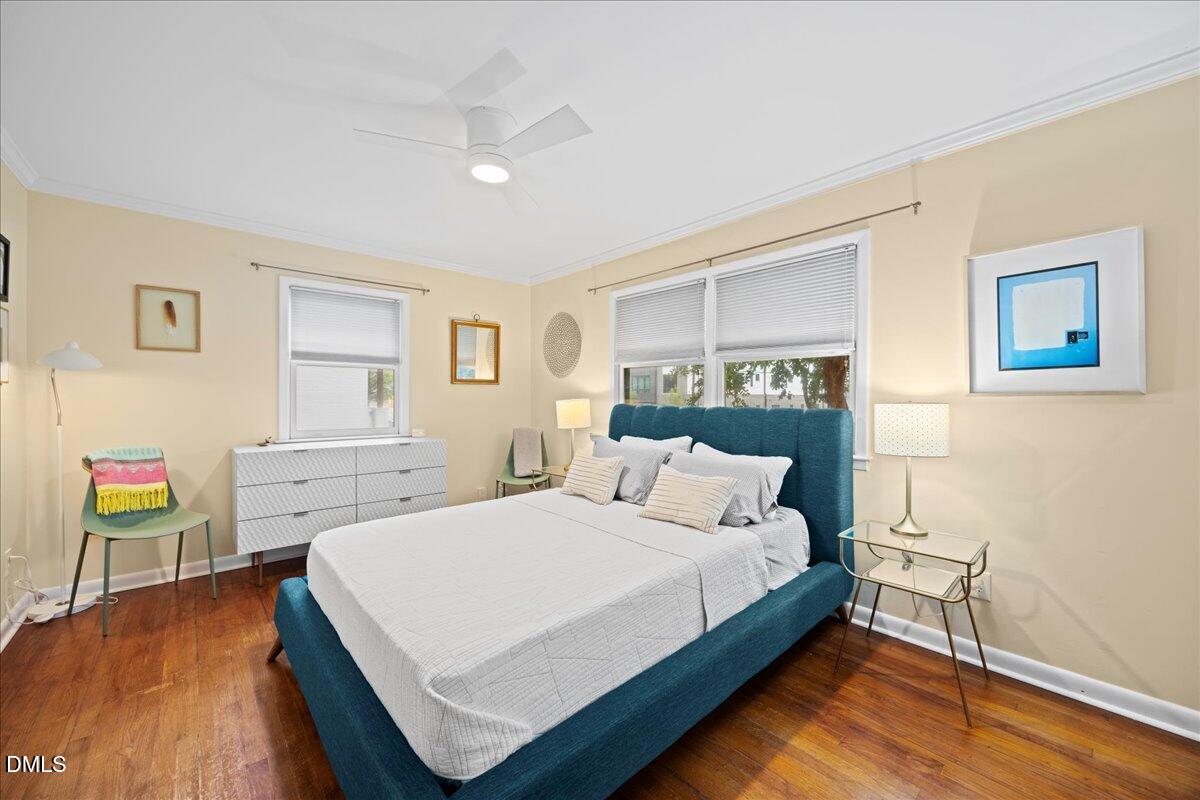 1212 Brookside Drive Raleigh, NC 27604 - Photo 27 of 42 a bedroom with a bed and a desk