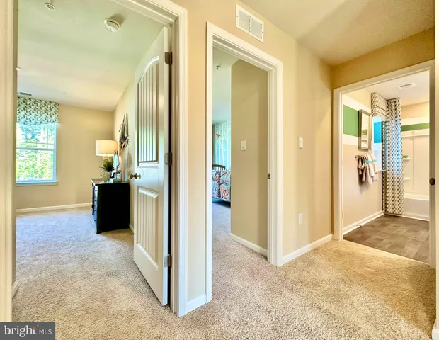 a bathroom with a granite countertop sink toilet tub and shower