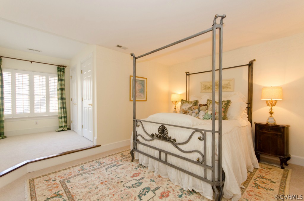 4200 Reeds Landing Circle Midlothian, VA 23113 - Photo 18 of 24 a spacious bedroom with a bed window and walk in closet