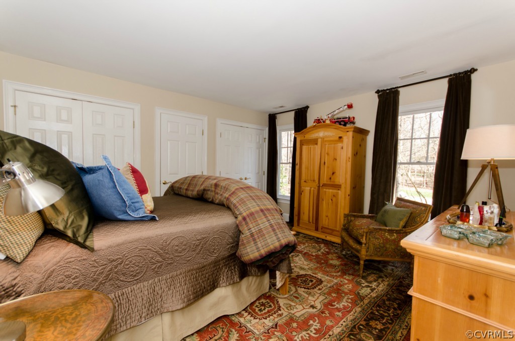 4200 Reeds Landing Circle Midlothian, VA 23113 - Photo 19 of 24 a bedroom with a bed and wooden floor