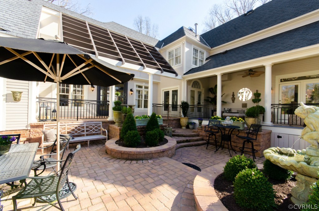 4200 Reeds Landing Circle Midlothian, VA 23113 - Photo 2 of 24 a roof deck with table and chairs potted plants