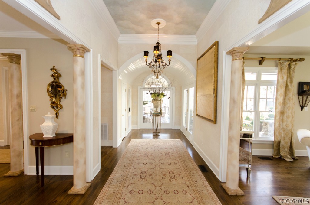 4200 Reeds Landing Circle Midlothian, VA 23113 - Photo 3 of 24 a view of a hallway with wooden floor and a living room