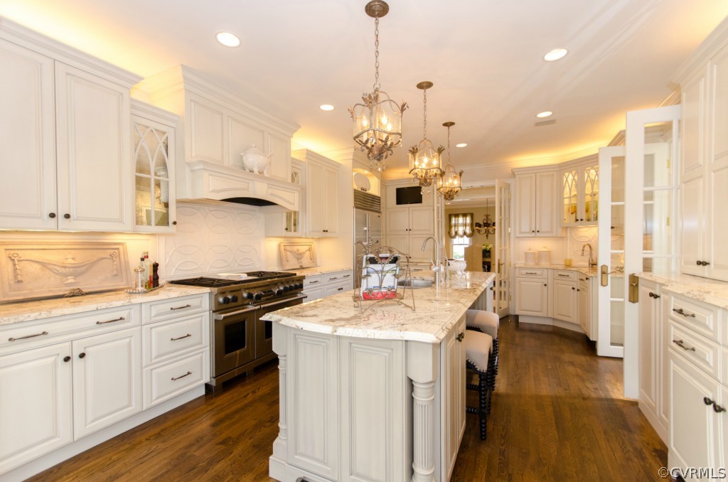 4200 Reeds Landing Circle Midlothian, VA 23113 - Photo 8 of 24 a kitchen with kitchen island a stove a sink a center island and cabinets