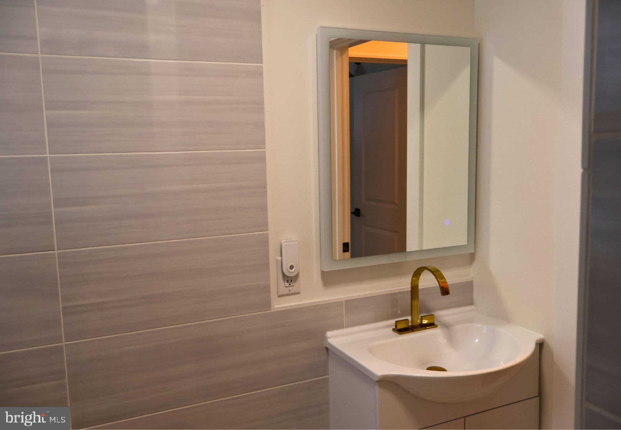 267 Buck Road Linden, VA 22642 - Photo 17 of 37 a bathroom with a sink and a mirror