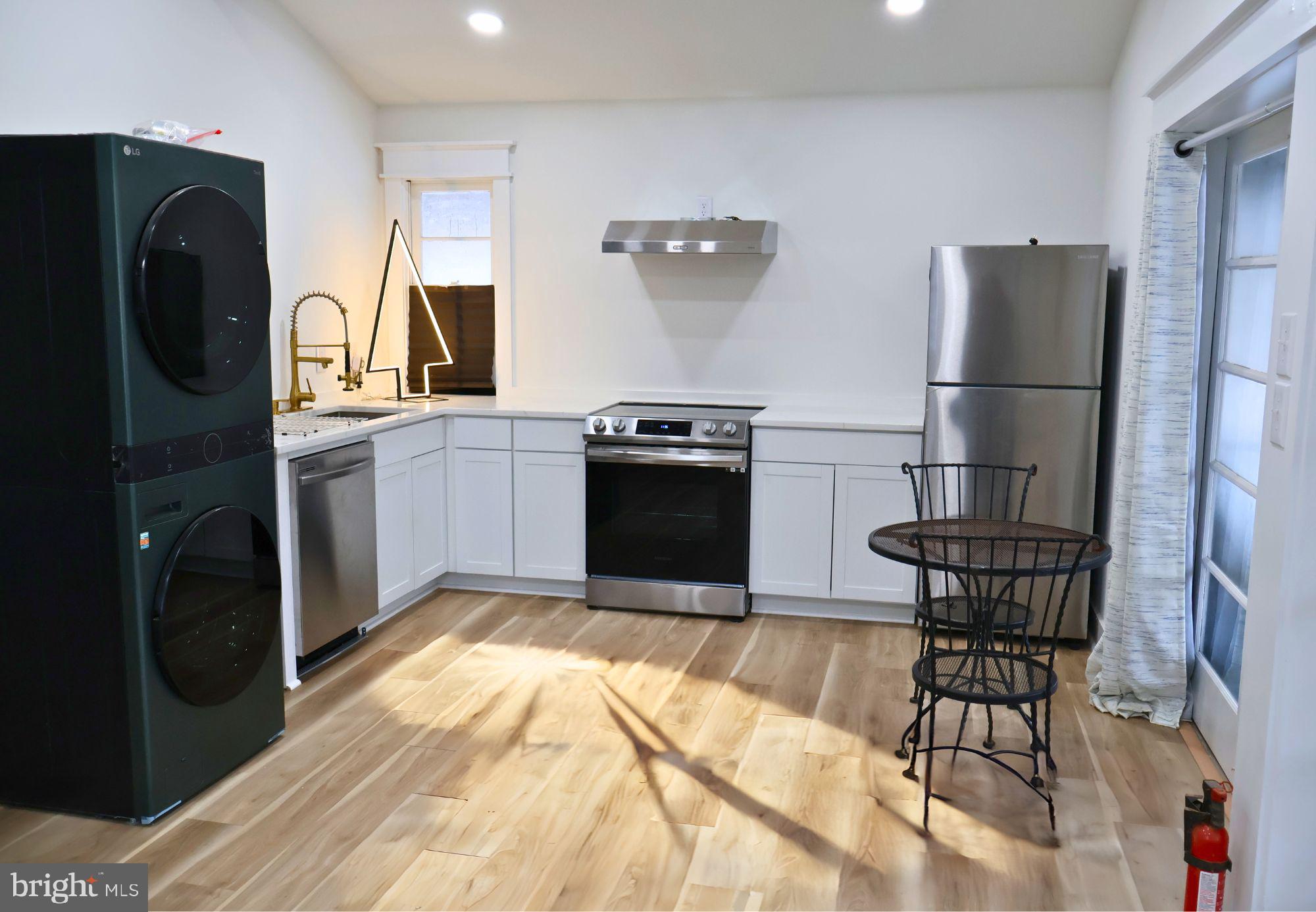 267 Buck Road Linden, VA 22642 - Photo 18 of 37 a kitchen with a refrigerator and a stove top oven
