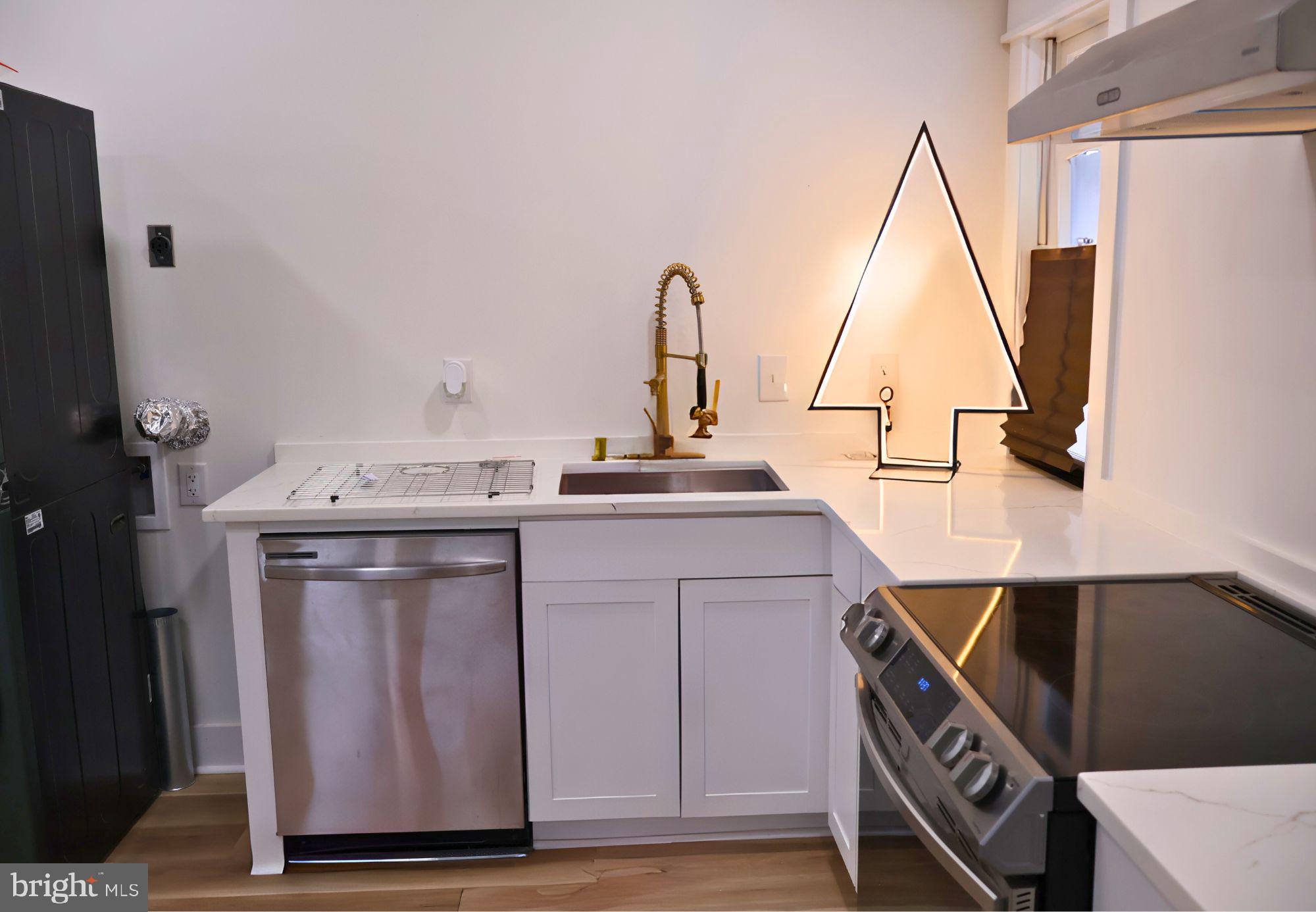 267 Buck Road Linden, VA 22642 - Photo 27 of 37 a kitchen with a sink and a stove top oven