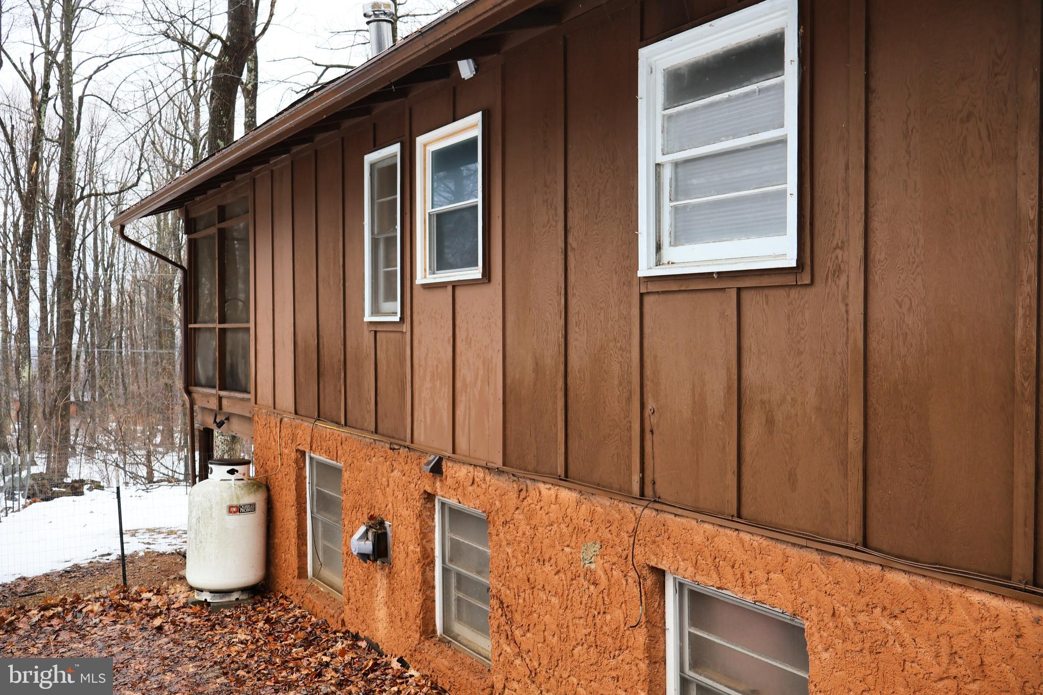 267 Buck Road Linden, VA 22642 - Photo 5 of 37 a backyard of a house with dishwasher and wooden fence