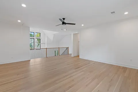 a view of room with hardwood floor and window