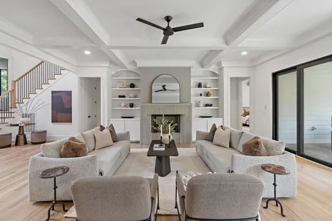 a living room with furniture or couches and a potted plant