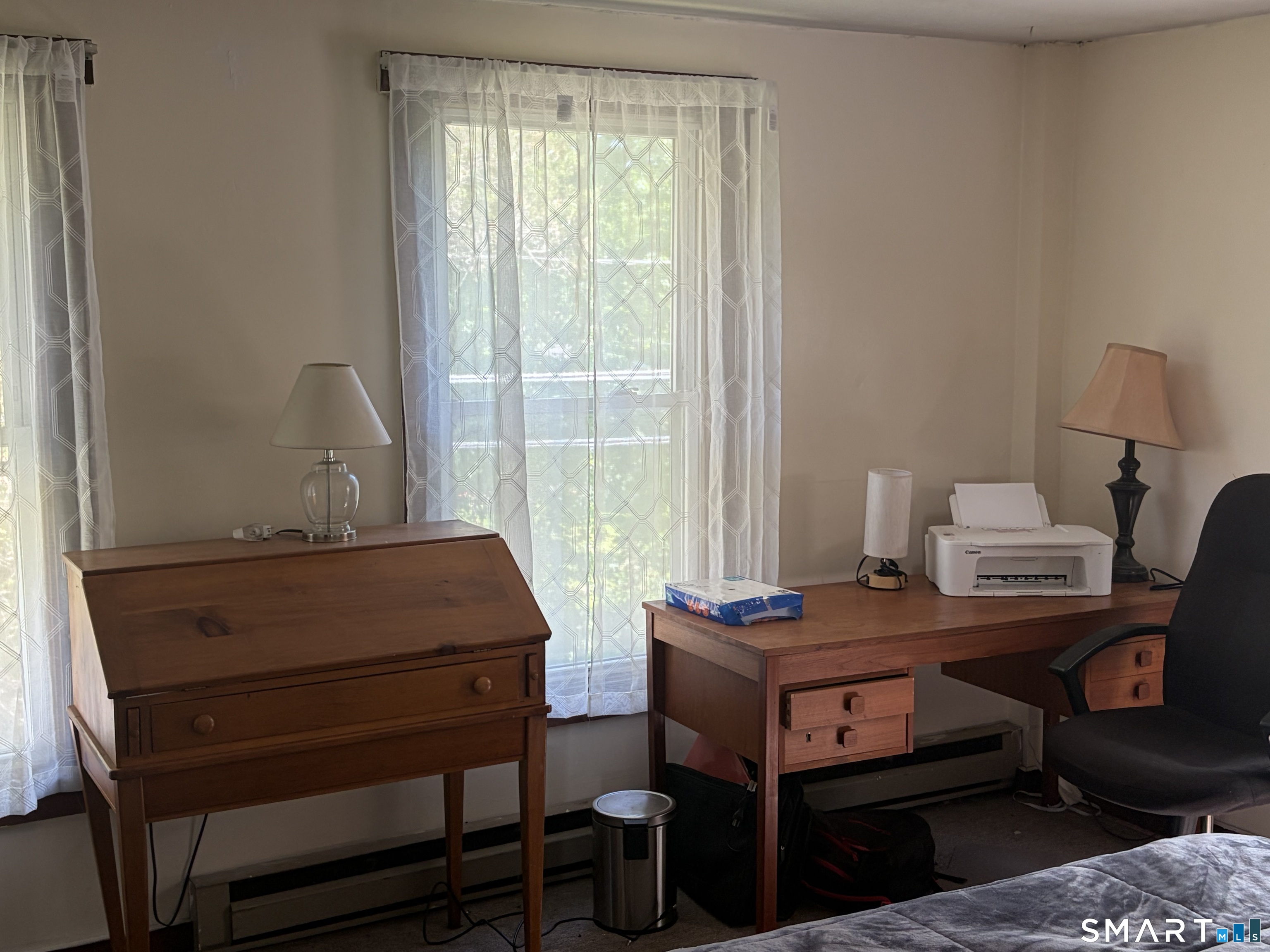 1079 Main Street Coventry, CT 06238 - Photo 13 of 19 a room with furniture and a window