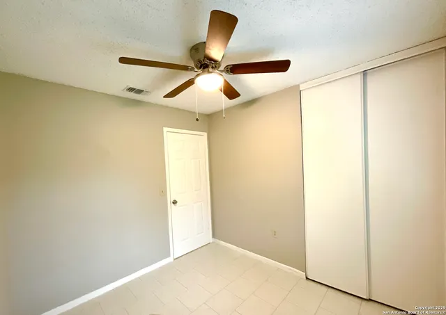 a view of a hallway with a chandelier