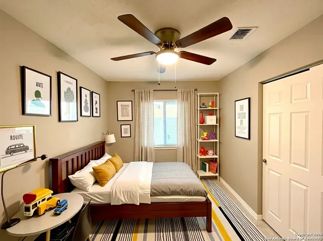 a bedroom with a bed furniture and a window