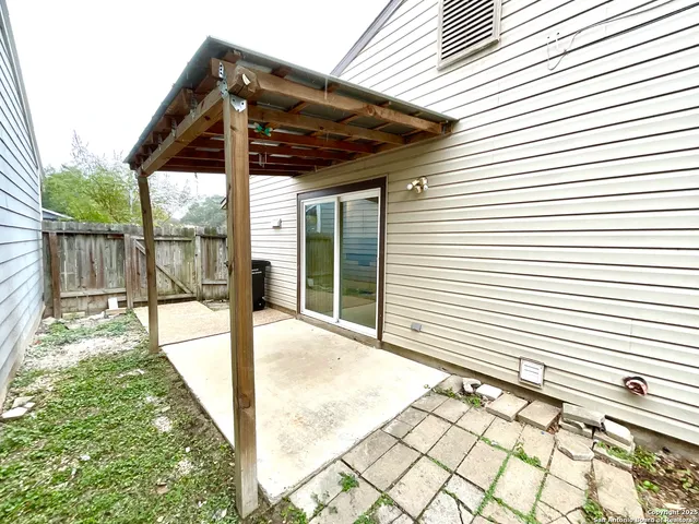 a house that has a tree in front of the house