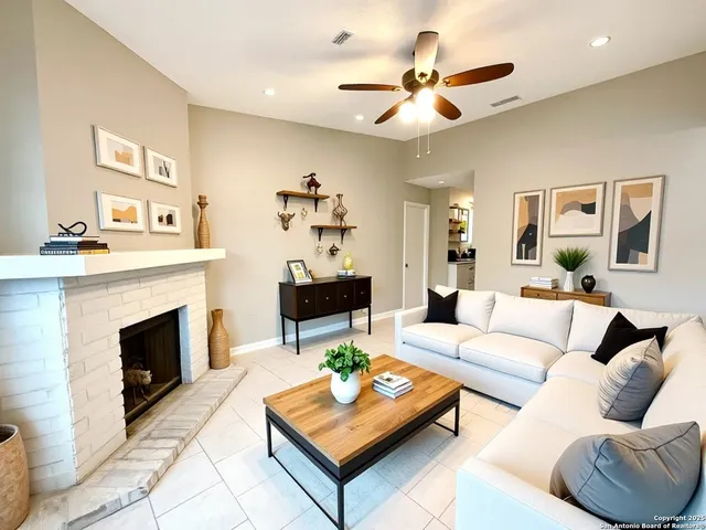 a living room with furniture and a fireplace