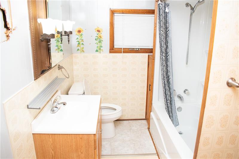 1924 Cherry Alley Monaca, PA 15061 - Photo 12 of 22 a bathroom with a sink a toilet and a shower curtain