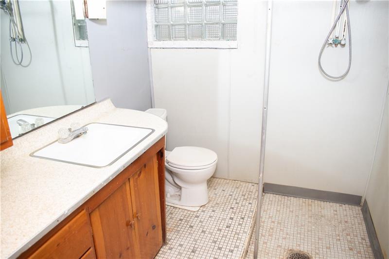 1924 Cherry Alley Monaca, PA 15061 - Photo 19 of 22 a bathroom with a granite countertop sink and a toilet
