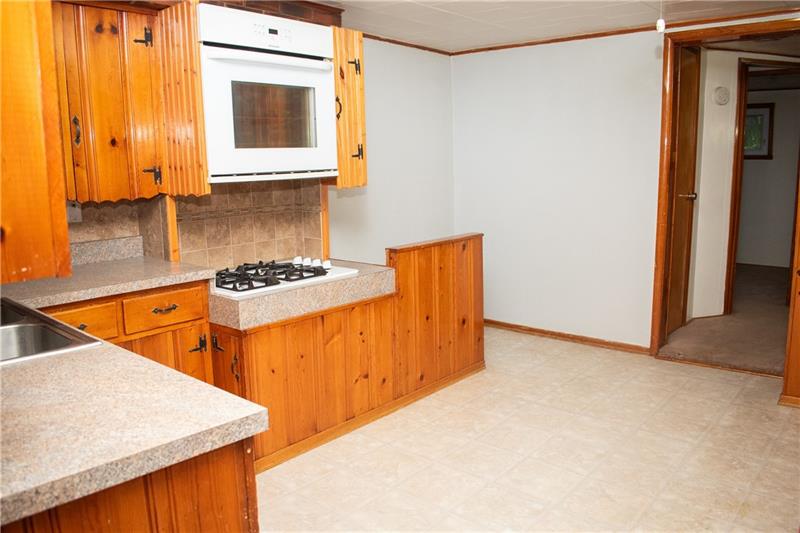 1924 Cherry Alley Monaca, PA 15061 - Photo 3 of 22 a kitchen with stainless steel appliances granite countertop a sink and a stove