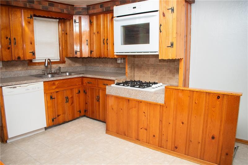 1924 Cherry Alley Monaca, PA 15061 - Photo 5 of 22 a kitchen with stainless steel appliances granite countertop a sink and a microwave