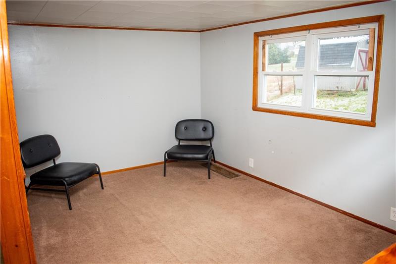 1924 Cherry Alley Monaca, PA 15061 - Photo 8 of 22 a room with a chair and a window