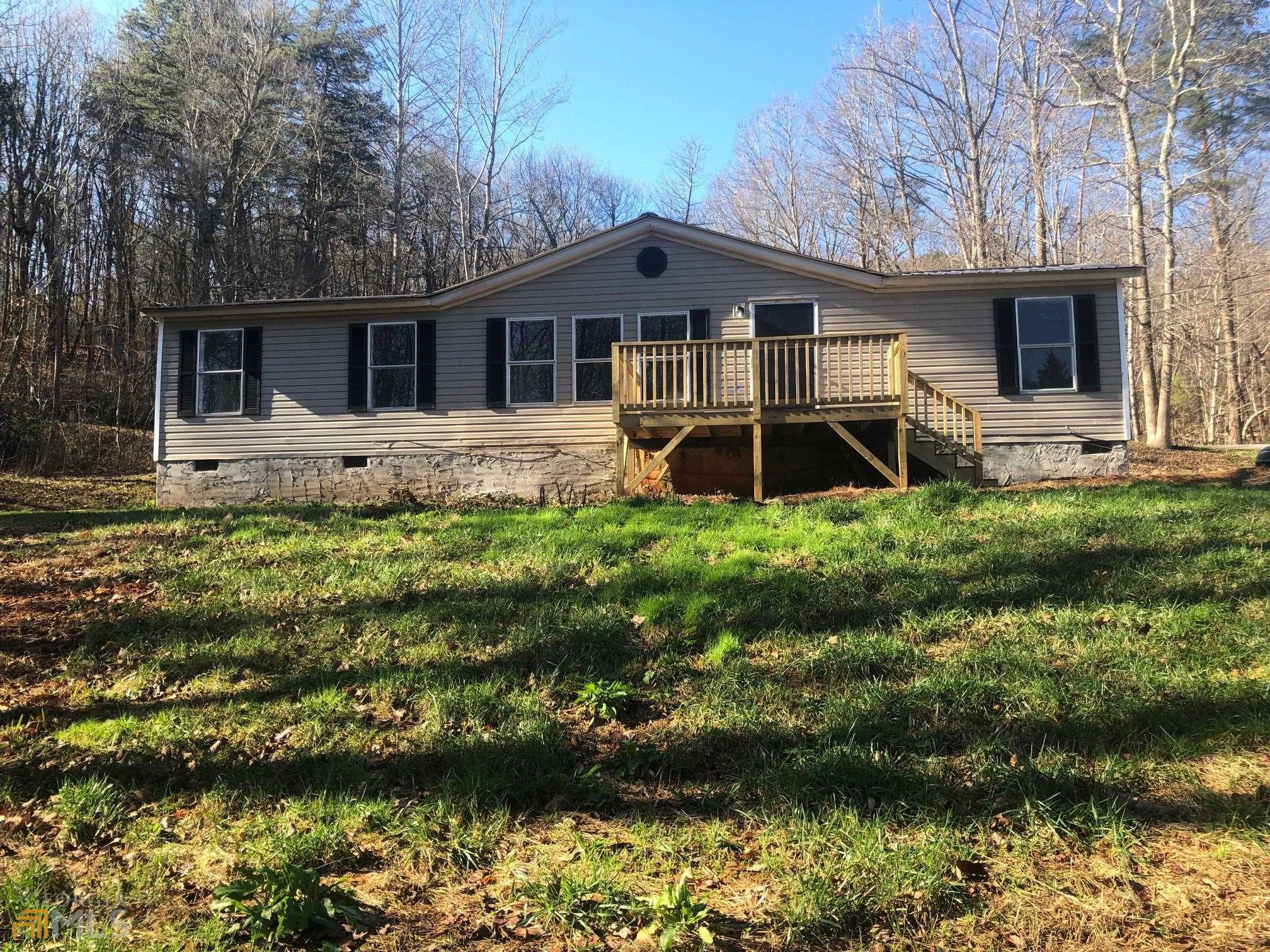 720 Partin Road Cleveland, GA 30528 - Photo 1 of 1 a front view of a house with a yard