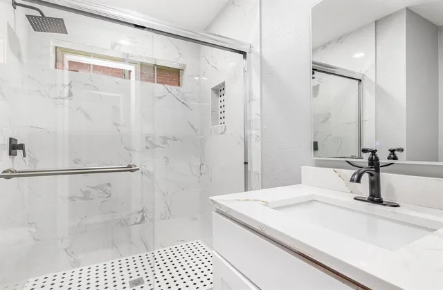 a bathroom with a sink and a mirror