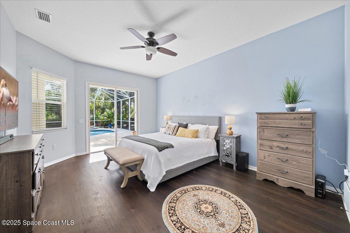 2409 Granger Road Cocoa, FL 32926 - Photo 24 of 36 a bedroom with a bed and a chandelier