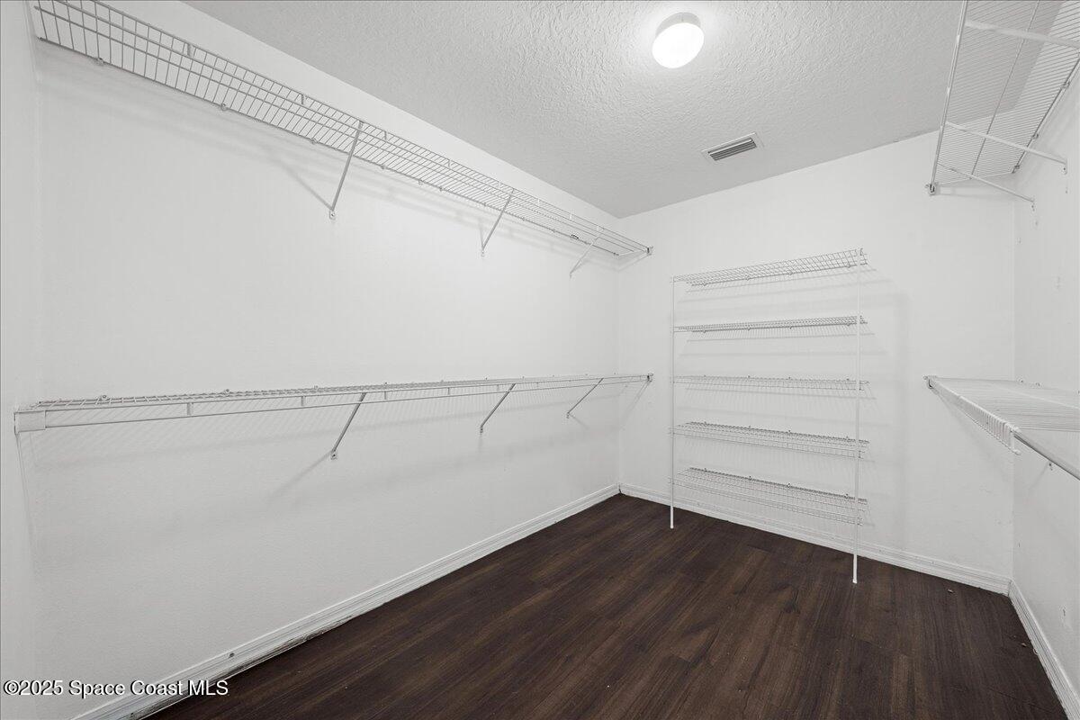 2409 Granger Road Cocoa, FL 32926 - Photo 25 of 36 a view of a room with racks on the wall